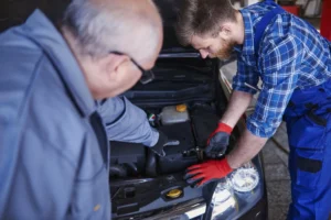 Automotive locksmith diagnosing car ignition repair in San Antonio, Texas.