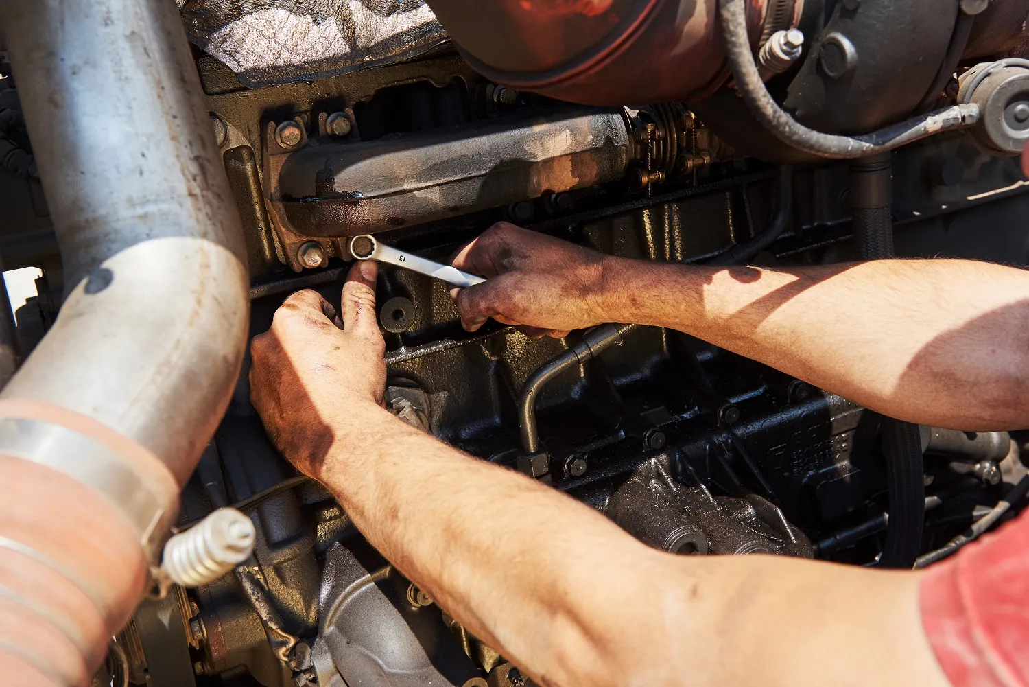 Technician repairing car ignition cylinder with wrench, same-day mobile service in San Antonio, TX.